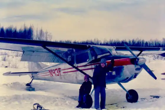 Me and my mom with the family Cessna 170B in Alaska